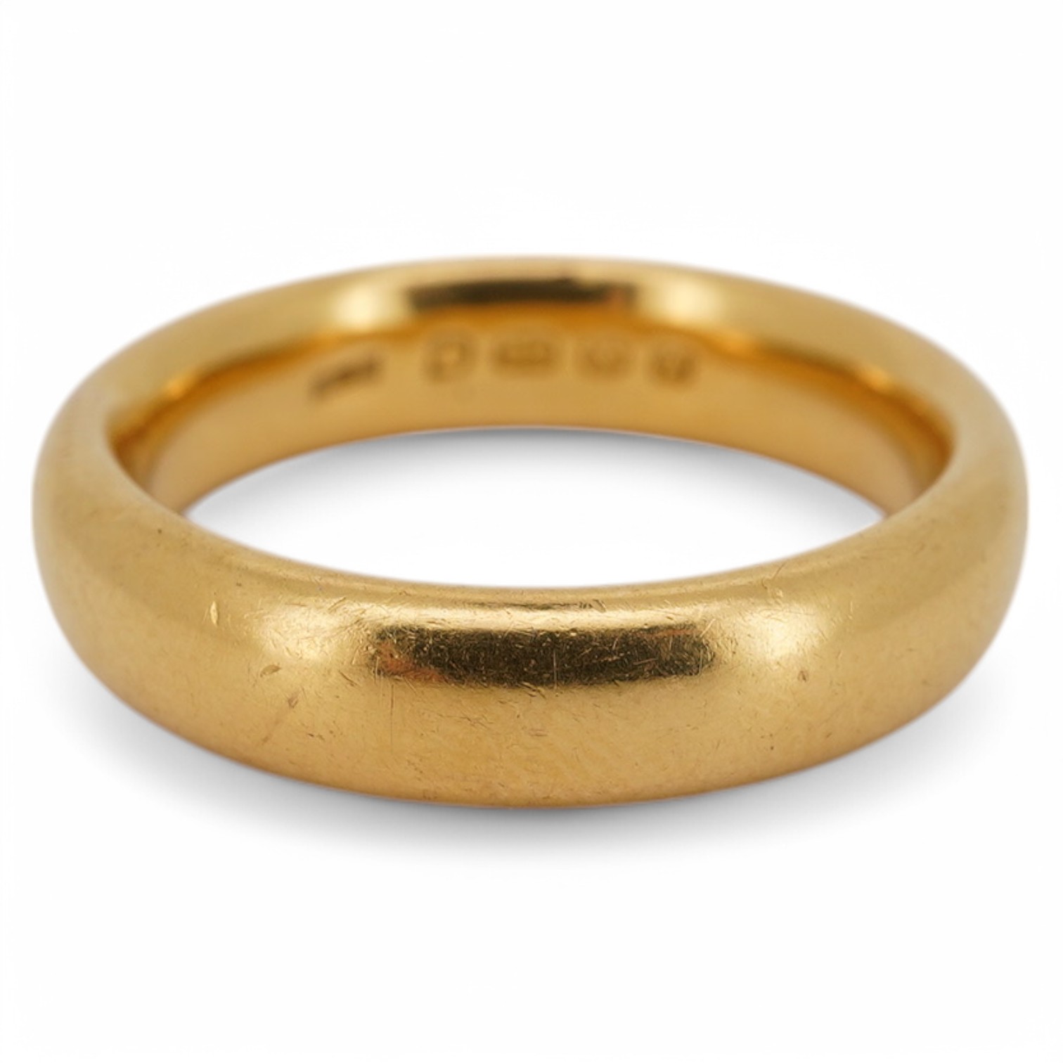 A George V 22ct gold wedding band, hallmarked for Birmingham, 1925, size M, 9 grams. Condition - good